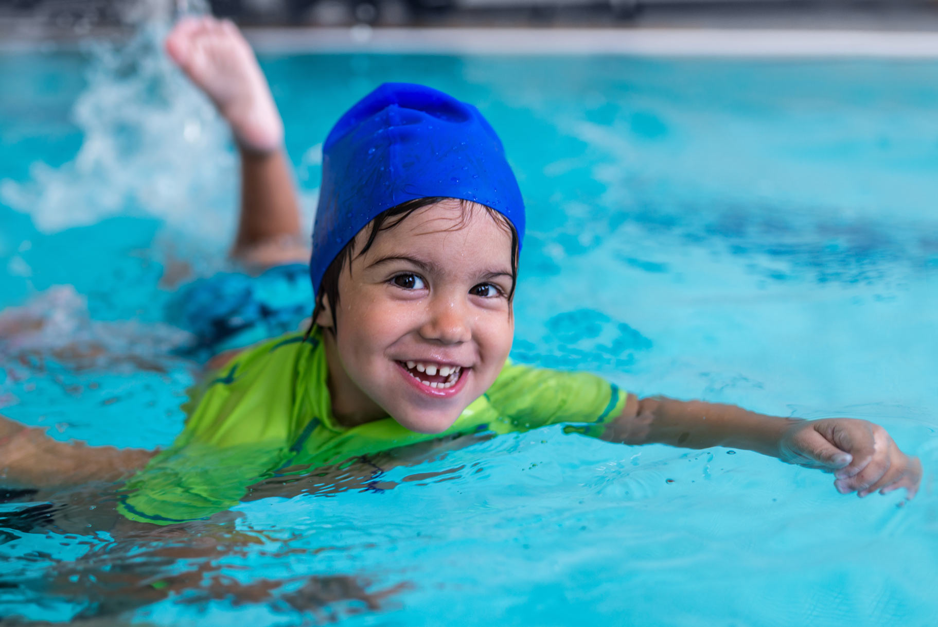 Child learning swimming in Vancouver kids’ lesson